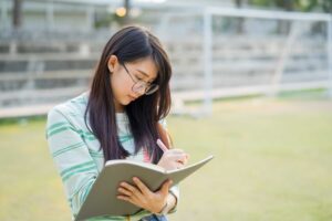 Academic Corner: Enhance Your Academic Skills 2 student completing university assignment