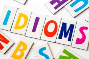 Business Idiom Examples: Learn with Simple Exercises 1 idioms written in colorful letters for students