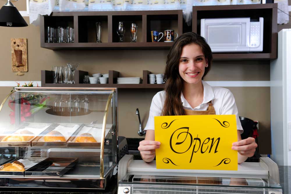 new business opening with young entrepreneur student