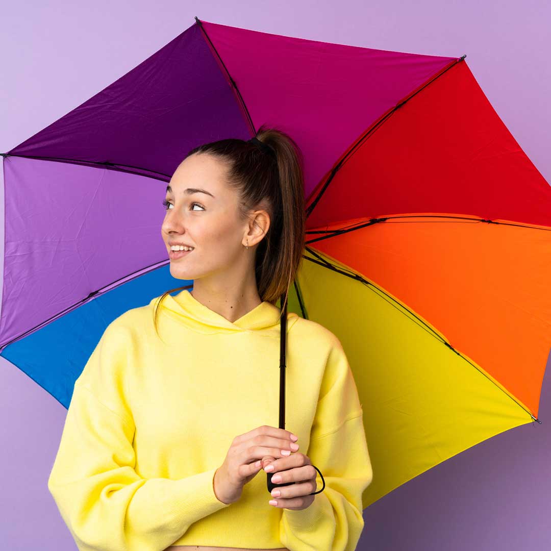 rain idioms image lady with rainbow umbrella as part of weather idioms series