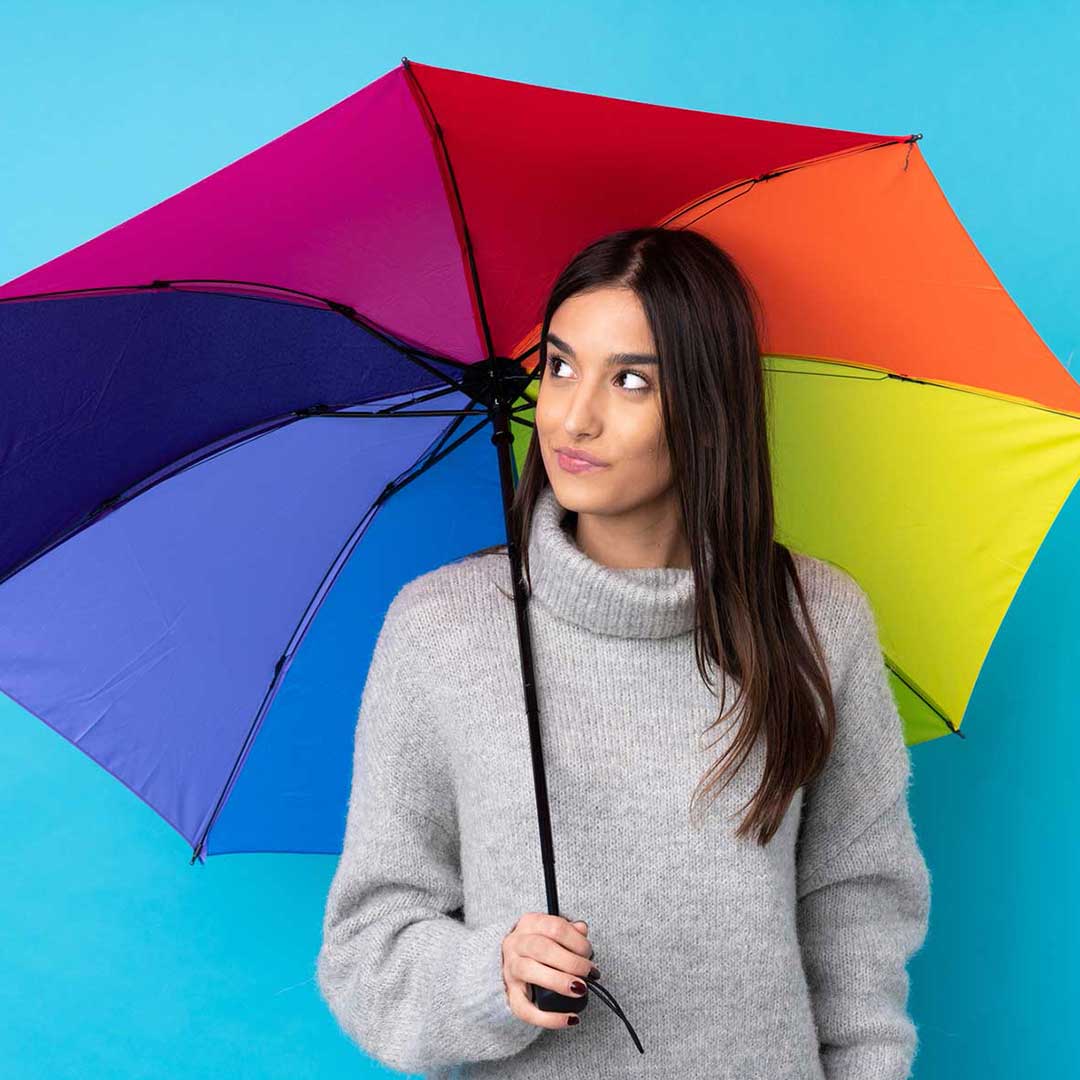 rain idioms image lady with rainbow umbrella as part of weather idioms series