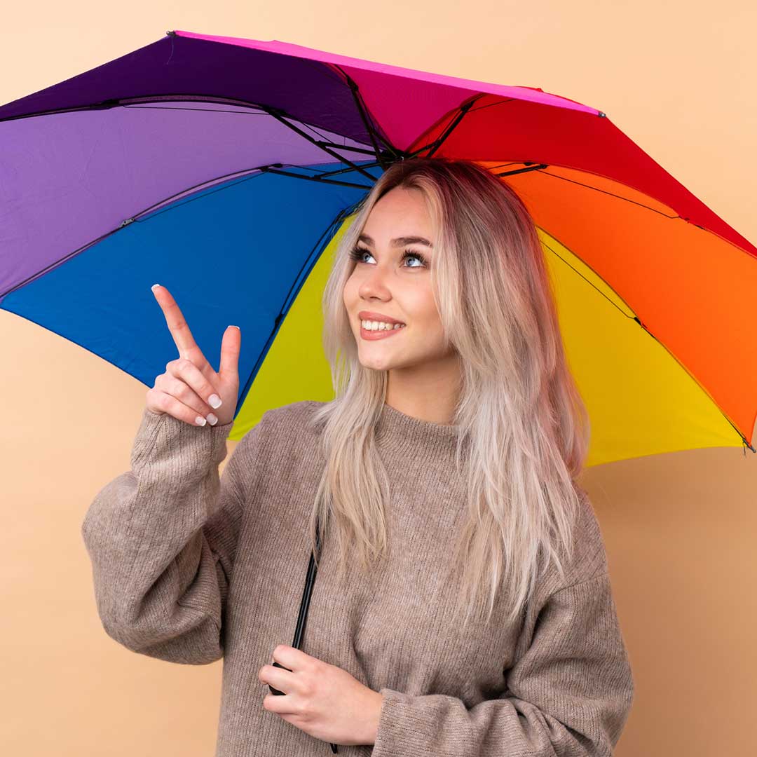 rain idioms image lady with rainbow umbrella as part of weather idioms series