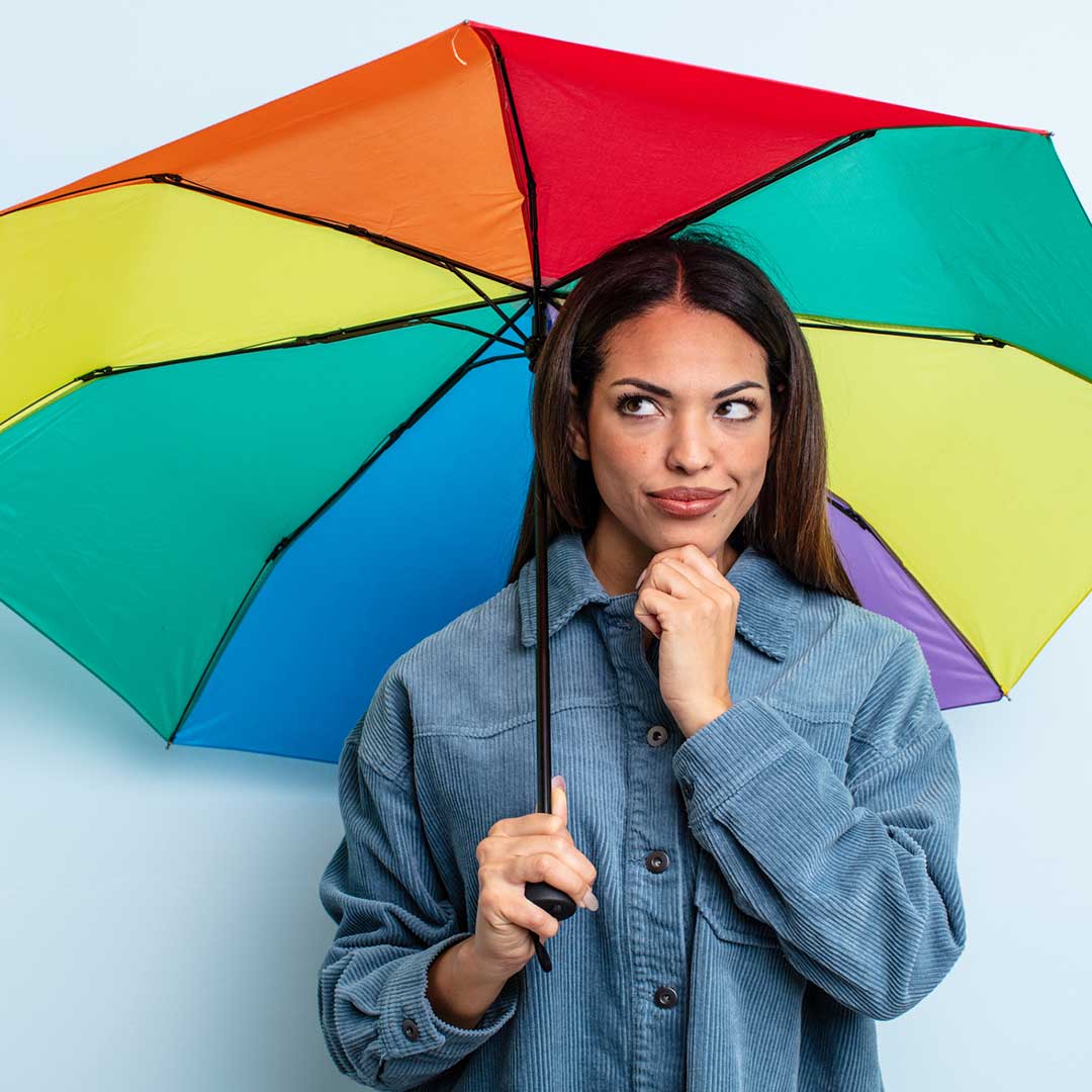 rain idioms image lady with rainbow umbrella as part of weather idioms series