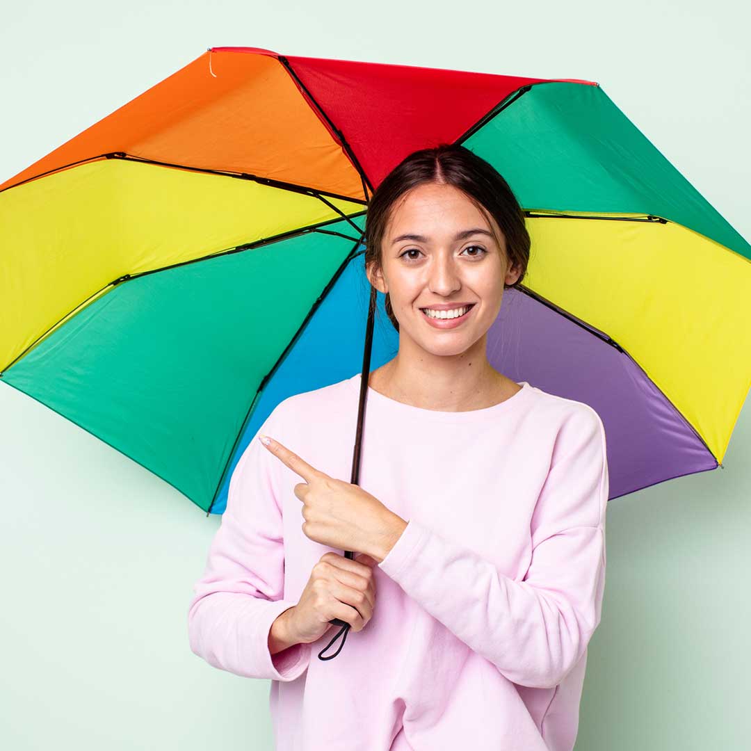 rain idioms image lady with rainbow umbrella as part of weather idioms series